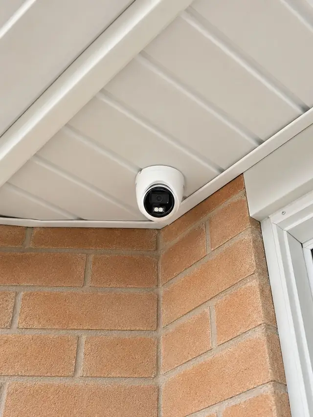 Dome camera on the corner of a home in Oakville